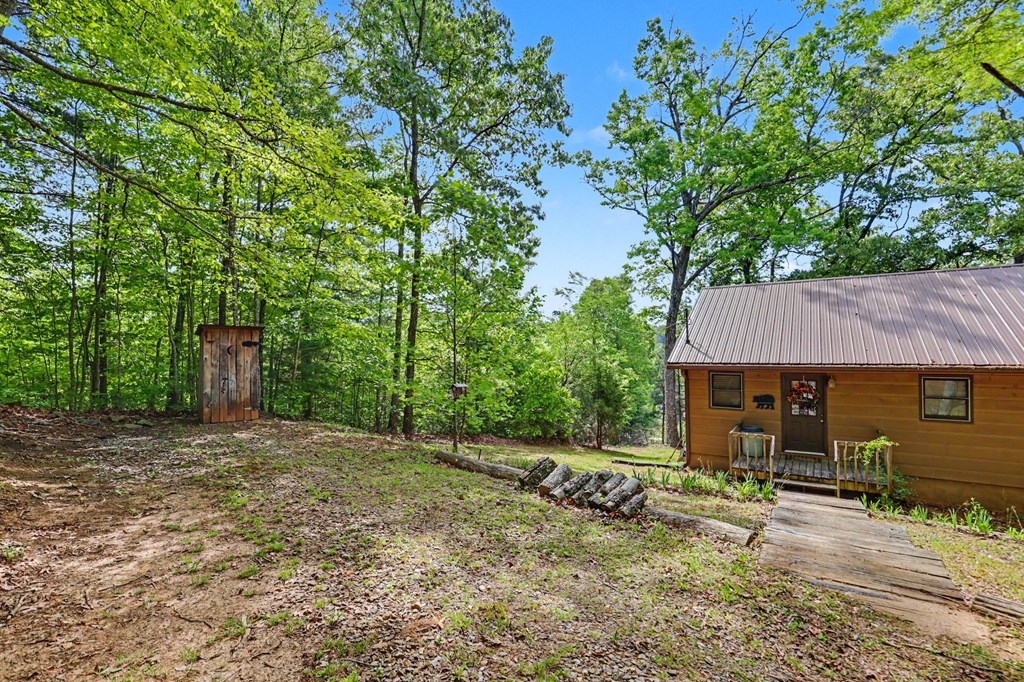 3235 Hiwassee Dam Access Road Murphy, NC 28906 - Photo 21 of 45 a backyard of a house with seating space