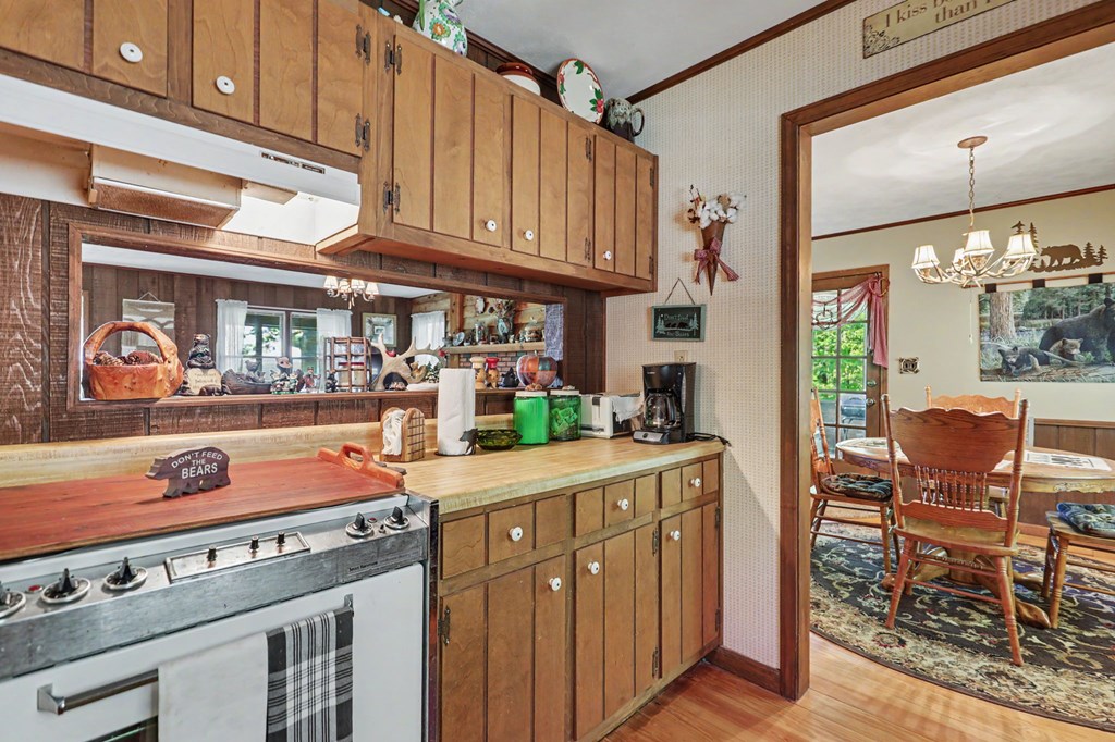 3235 Hiwassee Dam Access Road Murphy, NC 28906 - Photo 25 of 45 a kitchen with stainless steel appliances granite countertop a stove and cabinets