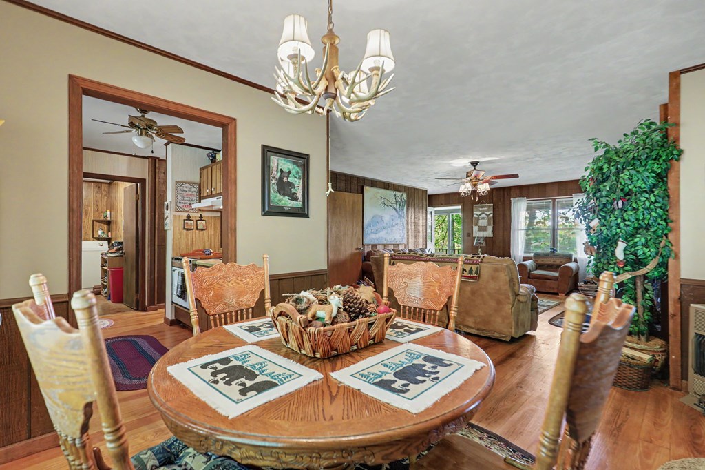 3235 Hiwassee Dam Access Road Murphy, NC 28906 - Photo 28 of 45 a living room with furniture and a chandelier