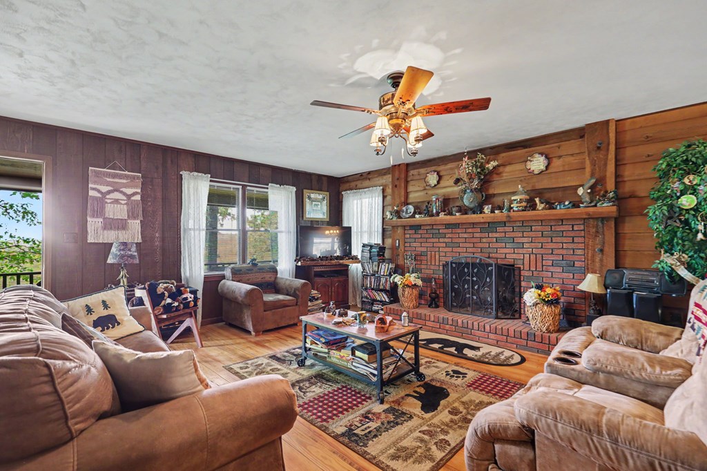 3235 Hiwassee Dam Access Road Murphy, NC 28906 - Photo 30 of 45 a living room with furniture and a fireplace