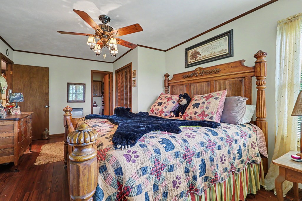 3235 Hiwassee Dam Access Road Murphy, NC 28906 - Photo 42 of 45 a bedroom with a bed and wooden floor