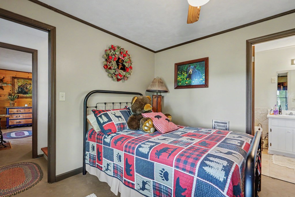 3235 Hiwassee Dam Access Road Murphy, NC 28906 - Photo 8 of 45 a bedroom with a bed and a painting on the wall