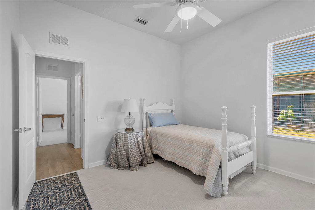 19015 Fern Meadow Loop Lutz, FL 33558 - Photo 28 of 50 a bedroom with a bed and a window