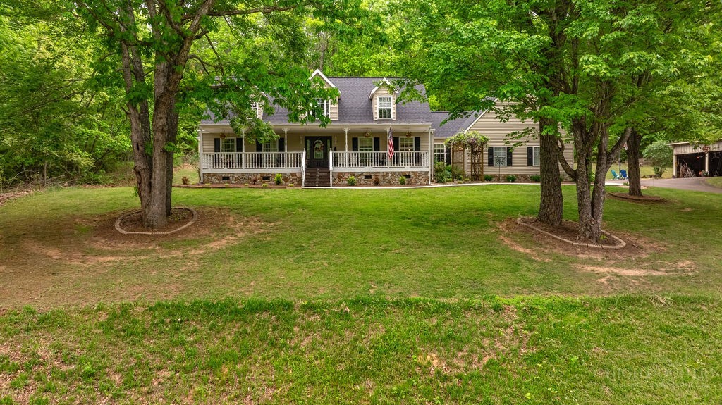 970 Vox Road Sparta, NC 28675 - Photo 6 of 50 a front view of a house with a yard