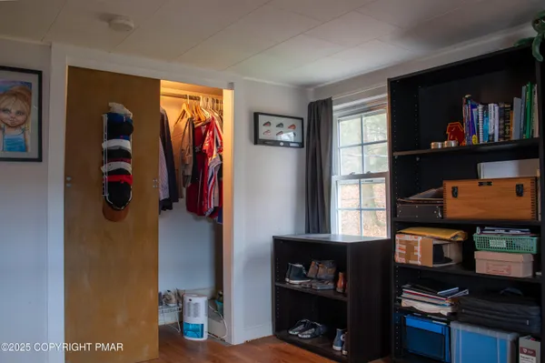 a view of hall way with furniture and a window