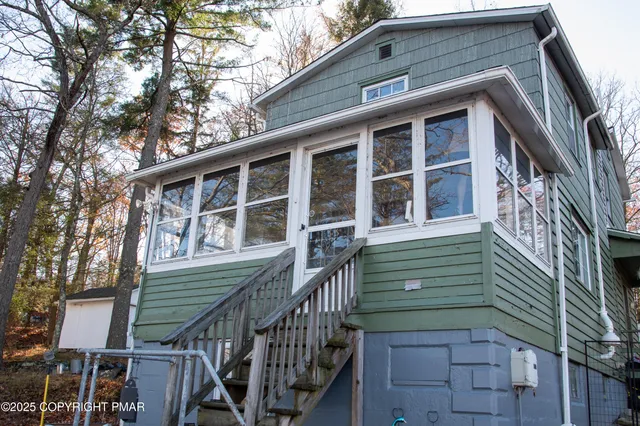 a view of a balcony with chairs