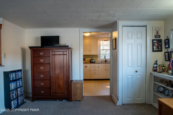 a view of living room with furniture and flat screen tv
