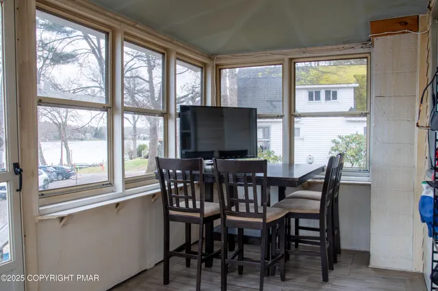 a view of a dining room with furniture window and outside view