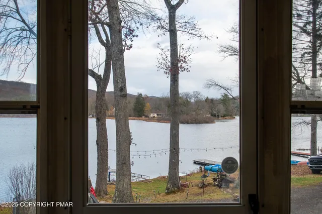 a kitchen with cabinets appliances a sink and a window