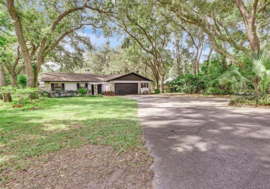 4308 Allen Road Fruitland Park, FL 34731 - Photo 3 of 33 a house view with a garden space