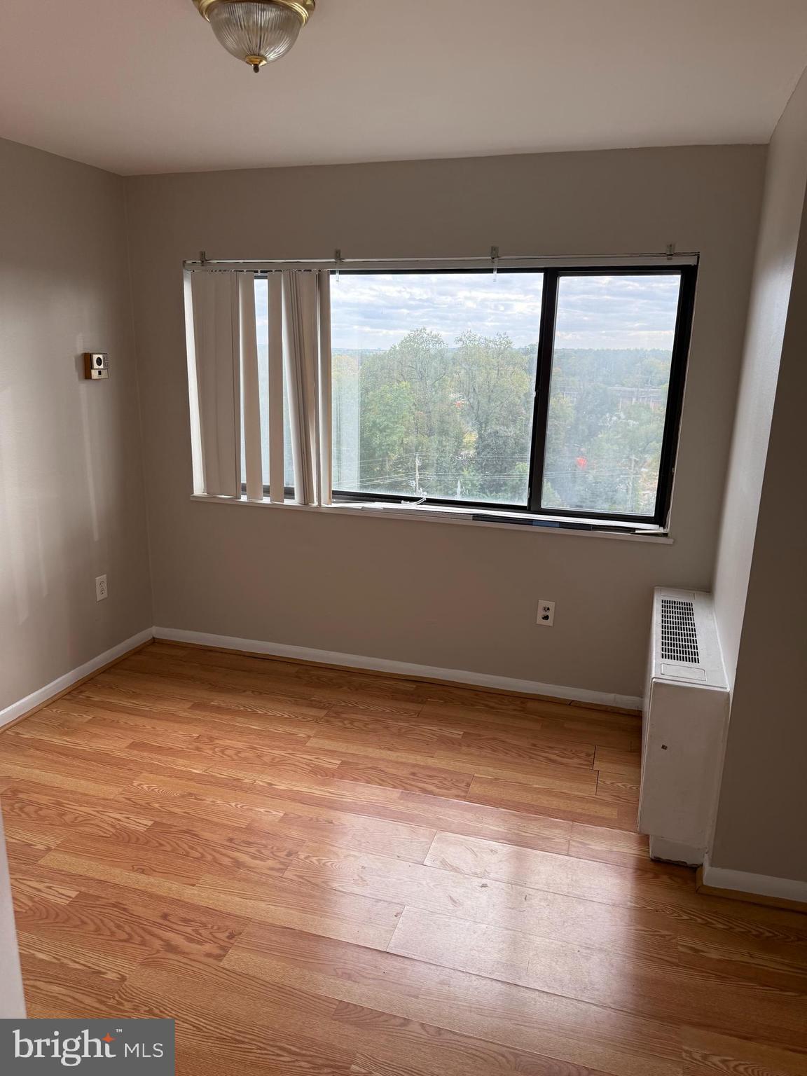8830 Piney Branch Road, Unit 1004 Silver Spring, MD 20903 - Photo 14 of 15 a view of an empty room with a window