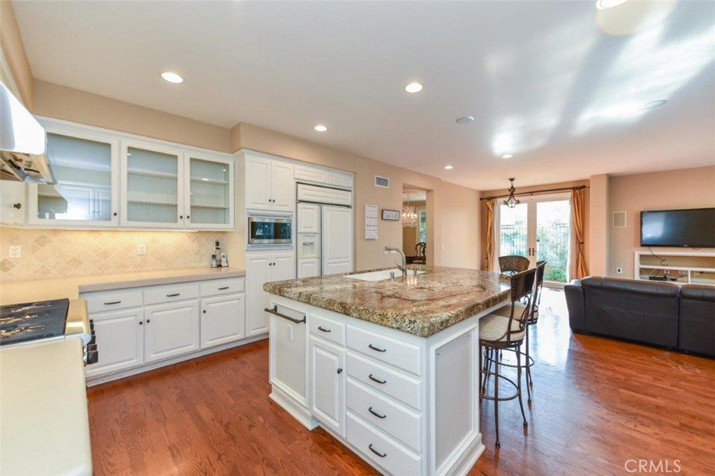 3 Plumbago Irvine, CA 92620 - Photo 18 of 51 a kitchen with stainless steel appliances granite countertop stove top oven and cabinets