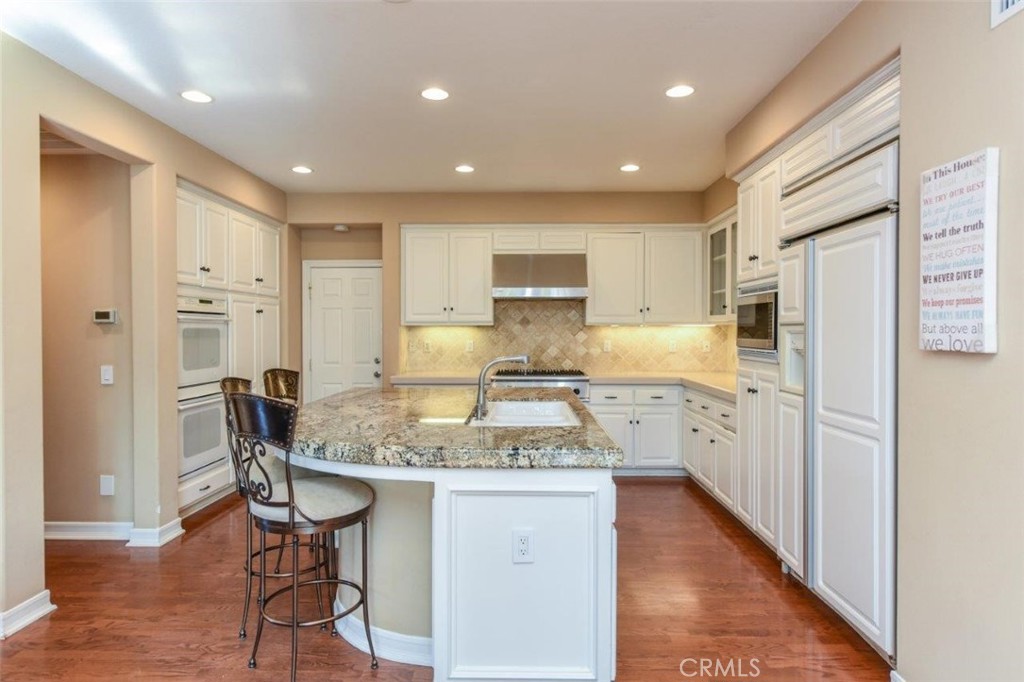 3 Plumbago Irvine, CA 92620 - Photo 21 of 51 a kitchen with stainless steel appliances granite countertop a refrigerator and a stove top oven