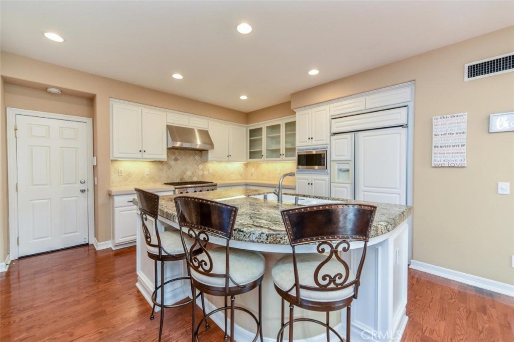 3 Plumbago Irvine, CA 92620 - Photo 22 of 51 a kitchen with stainless steel appliances granite countertop a stove a sink a microwave and a refrigerator