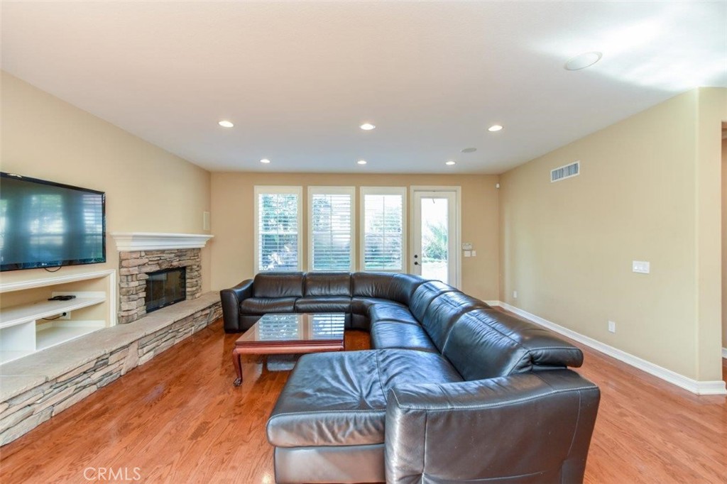 3 Plumbago Irvine, CA 92620 - Photo 24 of 51 a living room with furniture and a flat screen tv