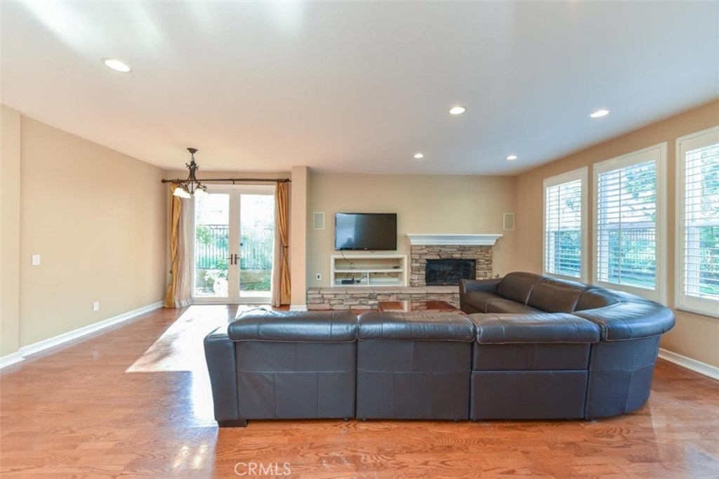 3 Plumbago Irvine, CA 92620 - Photo 27 of 51 a living room with furniture window and a flat screen tv