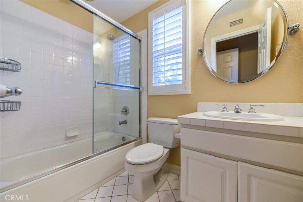 3 Plumbago Irvine, CA 92620 - Photo 32 of 51 a bathroom with a granite countertop sink toilet a mirror and shower