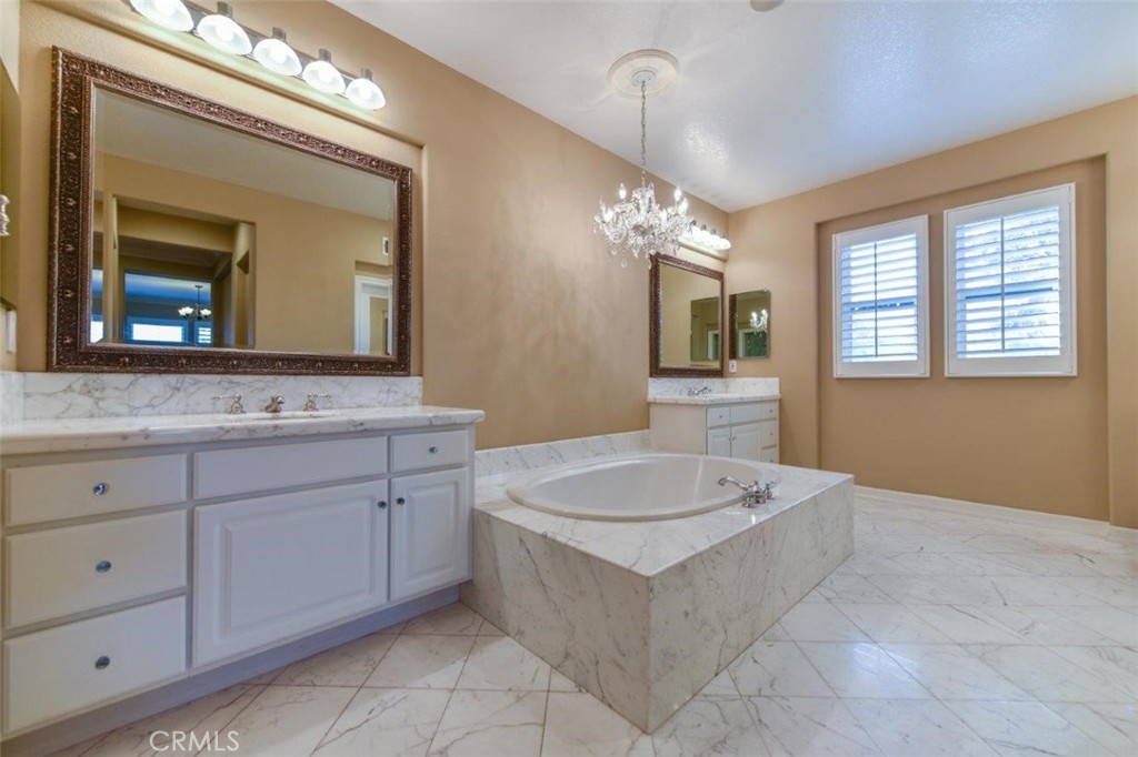3 Plumbago Irvine, CA 92620 - Photo 33 of 51 a spacious bathroom with a granite countertop sink mirror and bathtub