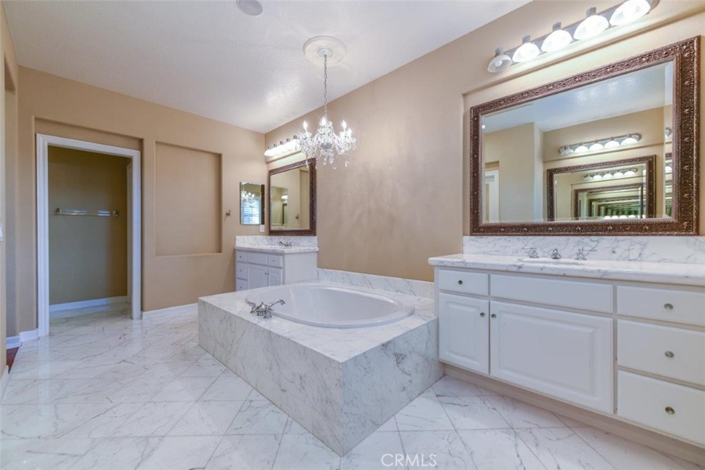3 Plumbago Irvine, CA 92620 - Photo 34 of 51 a spacious bathroom with a sink a mirror and a bathtub