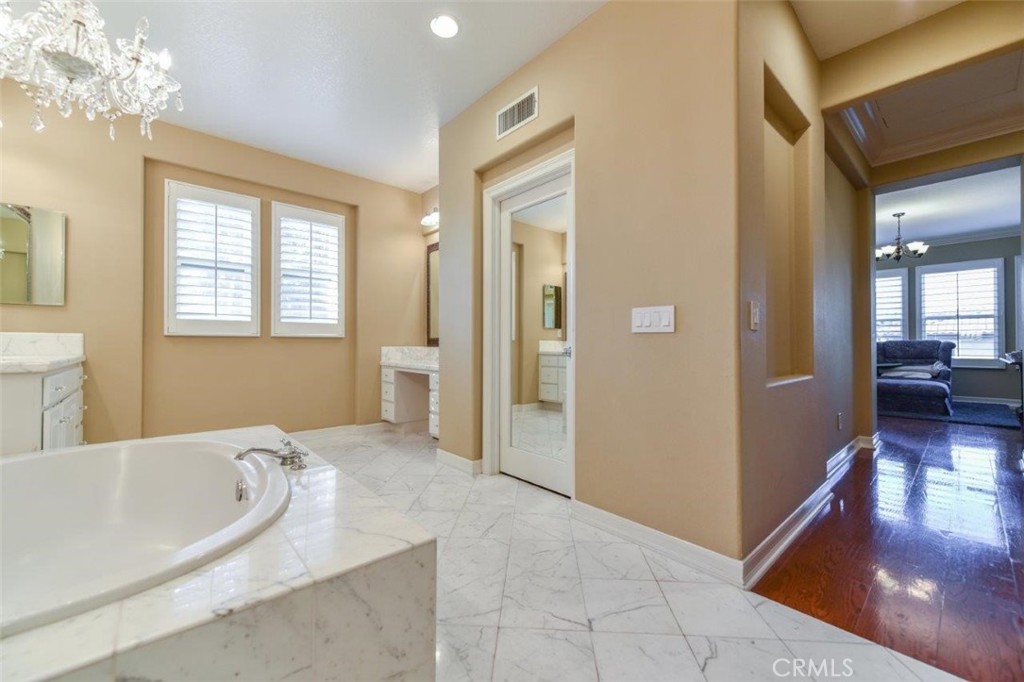 3 Plumbago Irvine, CA 92620 - Photo 35 of 51 a spacious bathroom with a tub sink and mirror