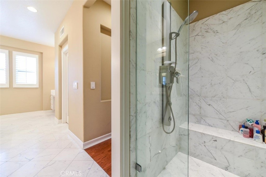 3 Plumbago Irvine, CA 92620 - Photo 36 of 51 a bathroom with a glass shower door