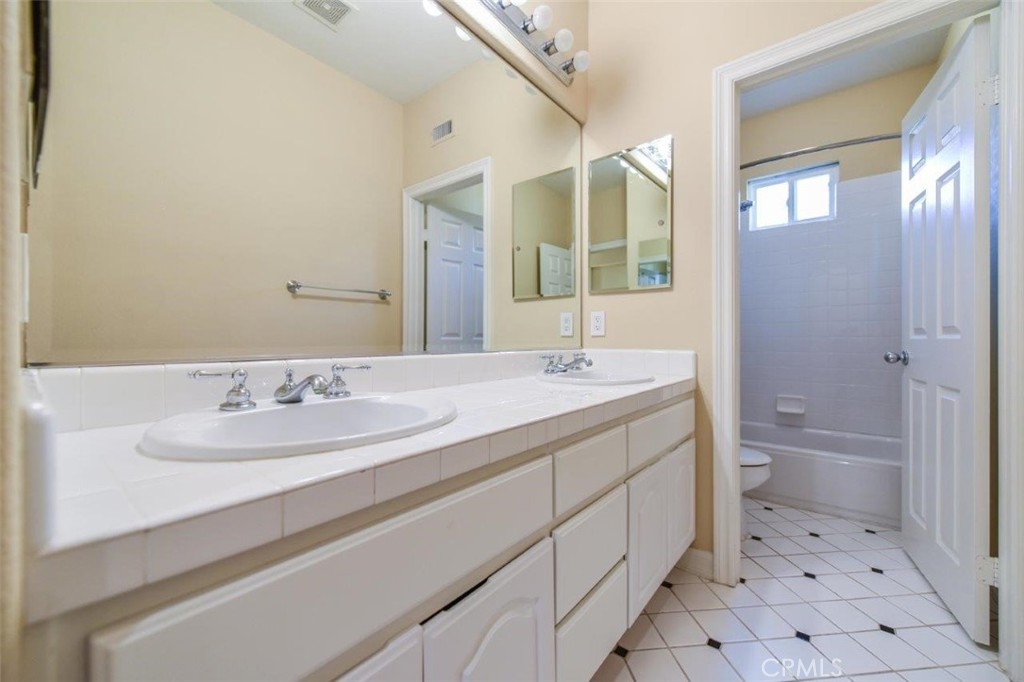 3 Plumbago Irvine, CA 92620 - Photo 38 of 51 a bathroom with a sink a toilet and shower