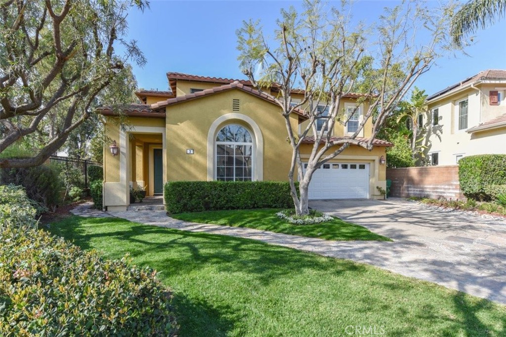 3 Plumbago Irvine, CA 92620 - Photo 6 of 51 a front view of a house with a yard