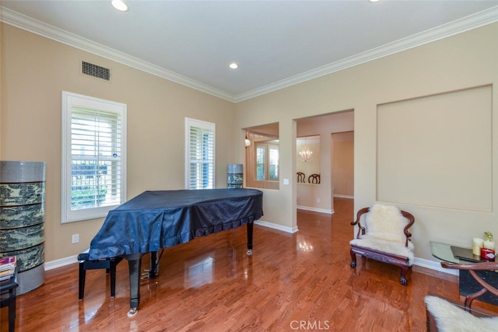 3 Plumbago Irvine, CA 92620 - Photo 9 of 51 a spacious bedroom with a bed and wooden floor