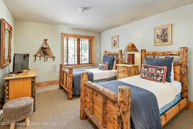 a bedroom with bed and window