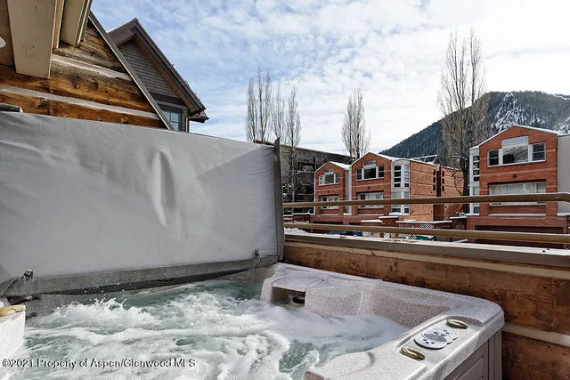 a view of living room and wooden floor