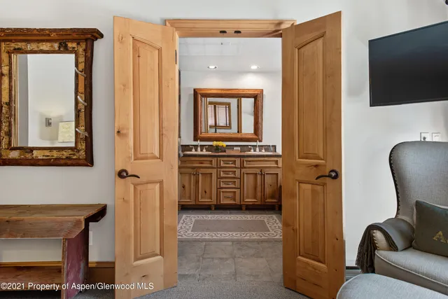 a view of a livingroom with furniture and a flat screen tv