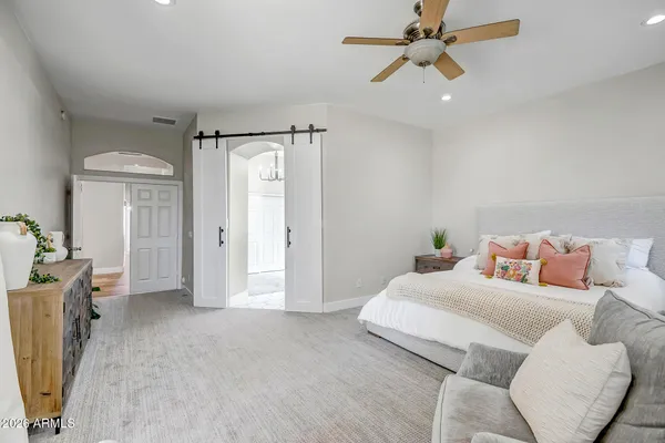 a kitchen with sink refrigerator and cabinets