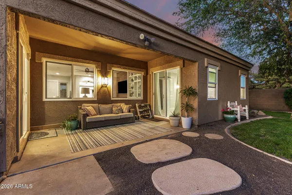 a backyard of a house with outdoor seating