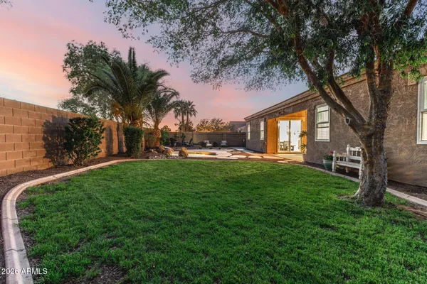 a view of a patio with couches and potted plants