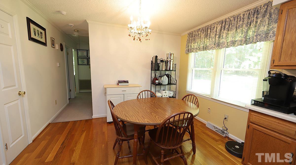 7121 Riley Hill Road Wendell, NC 27591 - Photo 6 of 16 a view of a dining room with furniture and a window