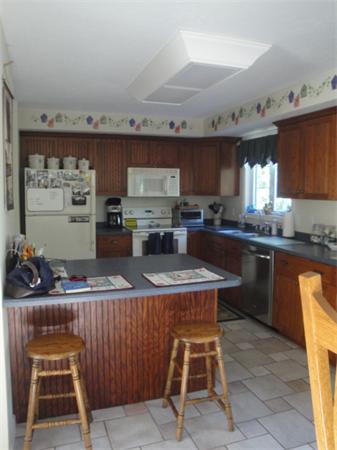 90 Haggerty Road Charlton, MA 01507 - Photo 4 of 23 a kitchen with granite countertop a sink and a stove