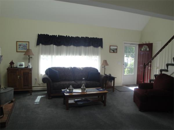 90 Haggerty Road Charlton, MA 01507 - Photo 5 of 23 a living room with furniture and a lamp