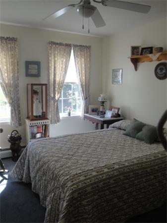 90 Haggerty Road Charlton, MA 01507 - Photo 8 of 23 a bedroom with a bed and a window