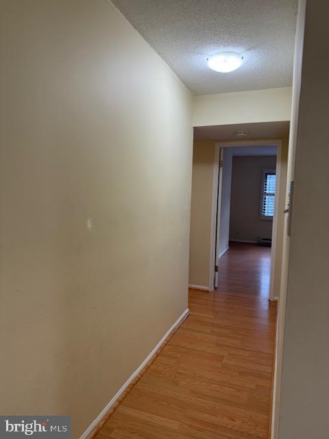 205 Yoakum Parkway, Unit 626 Alexandria, VA 22304 - Photo 25 of 83 a view of a hallway with wooden floor