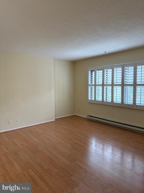 205 Yoakum Parkway, Unit 626 Alexandria, VA 22304 - Photo 38 of 83 a view of an empty room with wooden floor and a window