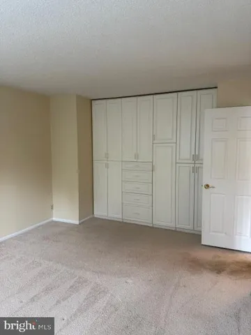 a picture of a floor to ceiling window next to a yard