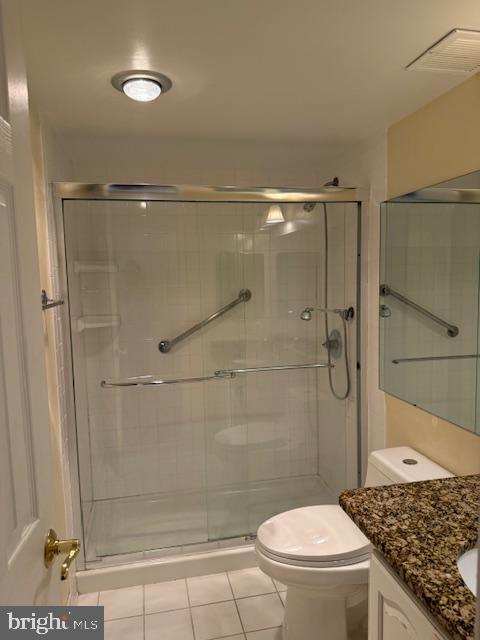 205 Yoakum Parkway, Unit 626 Alexandria, VA 22304 - Photo 40 of 83 a bathroom with a granite countertop shower a toilet and sink