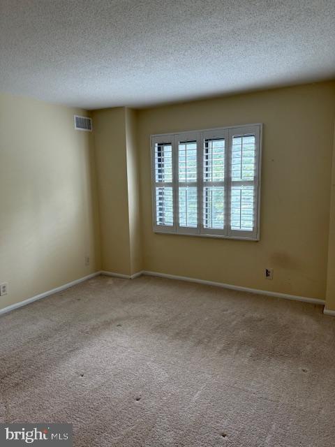 205 Yoakum Parkway, Unit 626 Alexandria, VA 22304 - Photo 44 of 83 an empty room with a empty space and windows