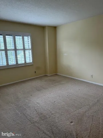 a view of living room with furniture and chandelier