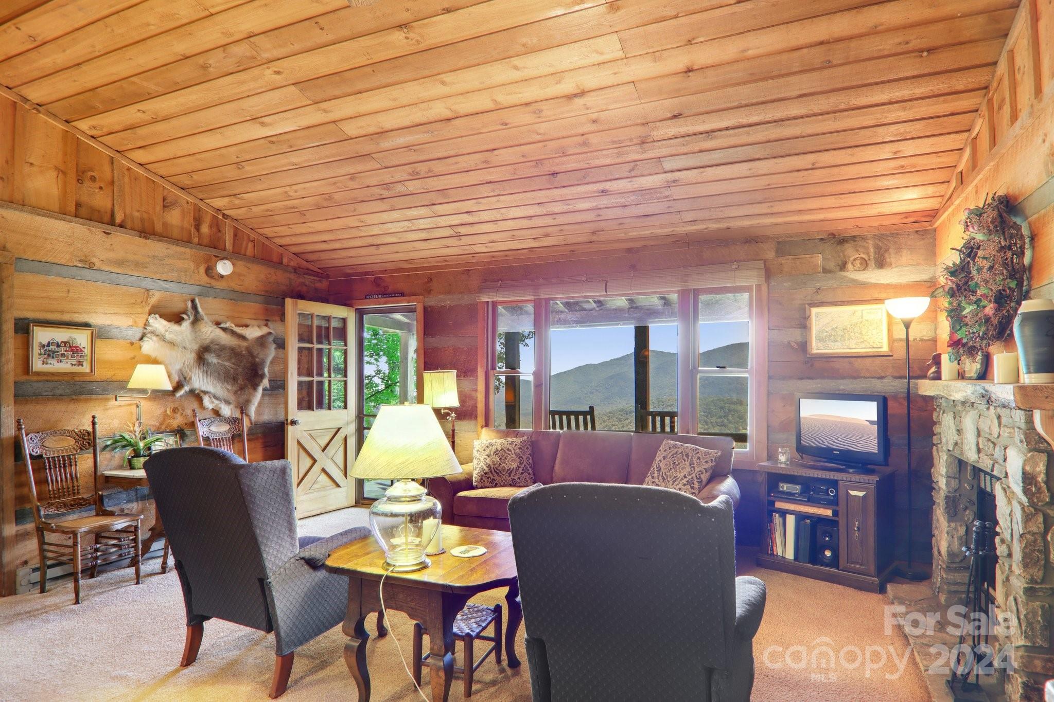 1685 Setzercove Road Maggie Valley, NC 28751 - Photo 11 of 42 a view of a dining room with furniture window and outside view