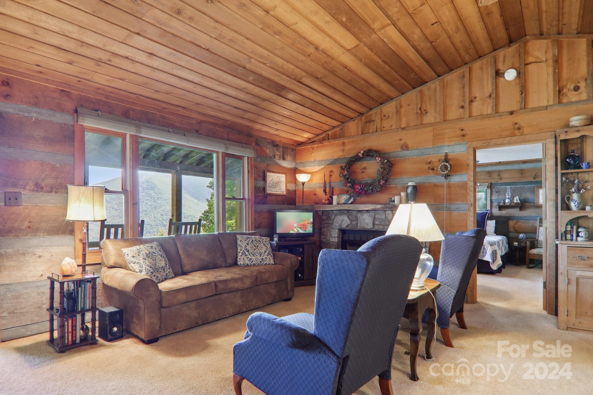 1685 Setzercove Road Maggie Valley, NC 28751 - Photo 12 of 42 a living room with furniture and a large window