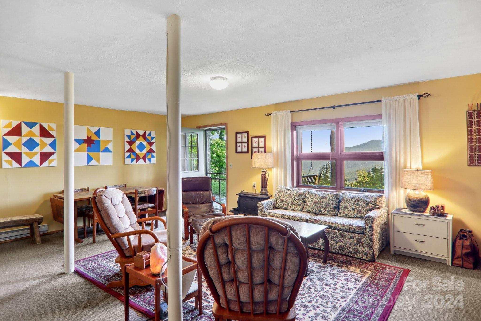 1685 Setzercove Road Maggie Valley, NC 28751 - Photo 27 of 42 a living room with furniture and a large window