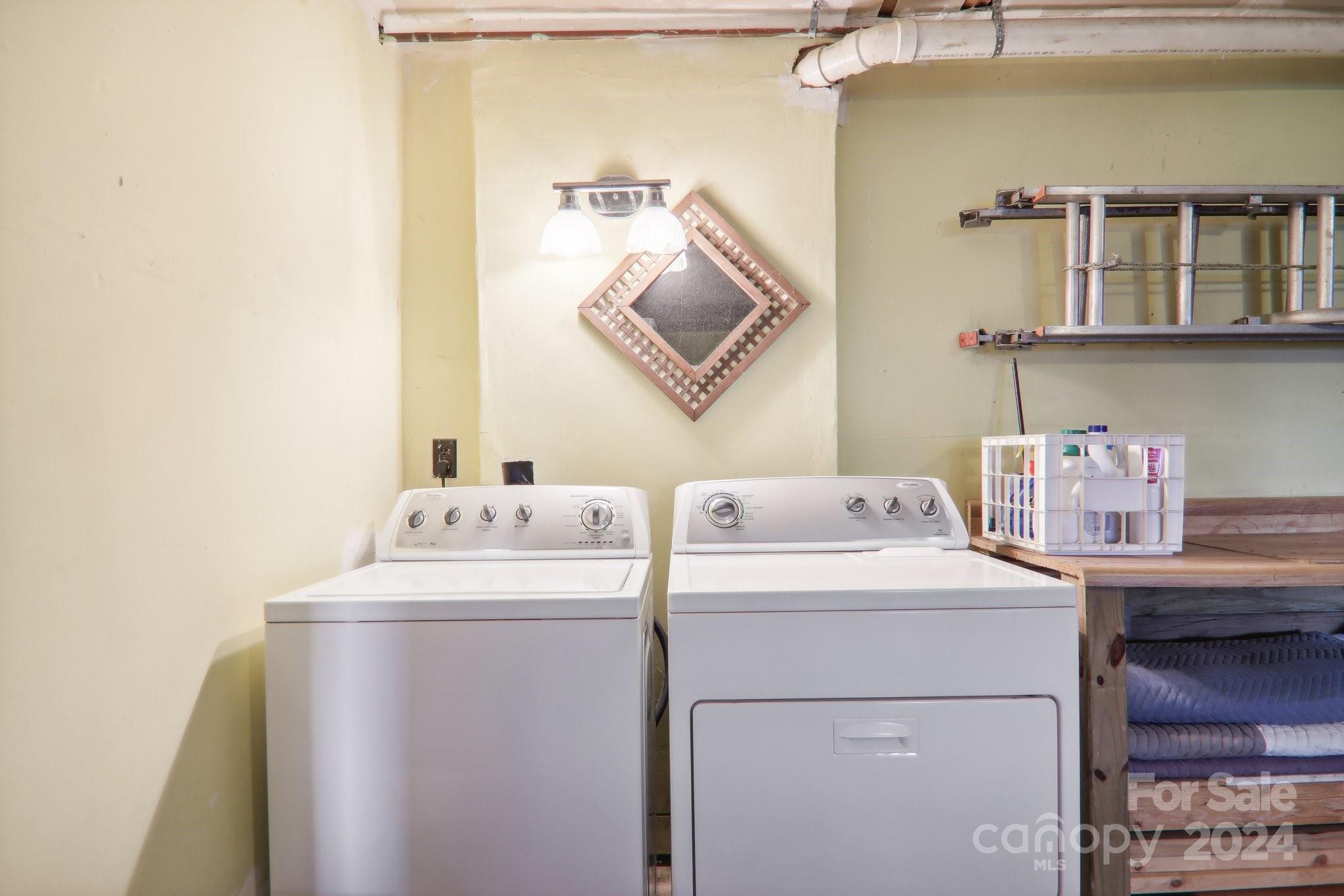 1685 Setzercove Road Maggie Valley, NC 28751 - Photo 28 of 42 a utility room with dryer and washer