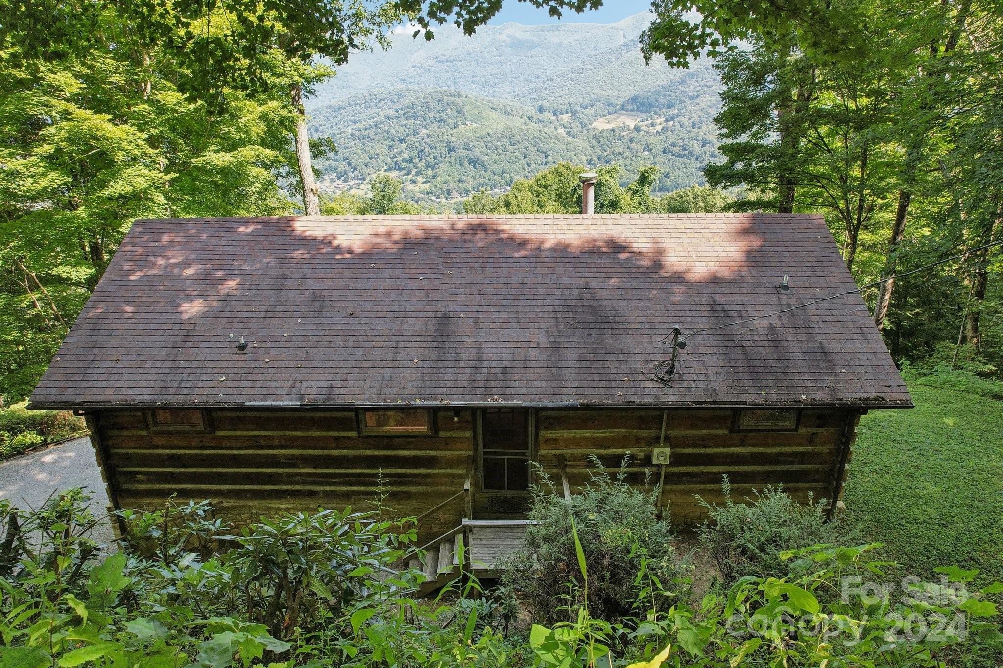 1685 Setzercove Road Maggie Valley, NC 28751 - Photo 3 of 42 an aerial view of a house with a yard