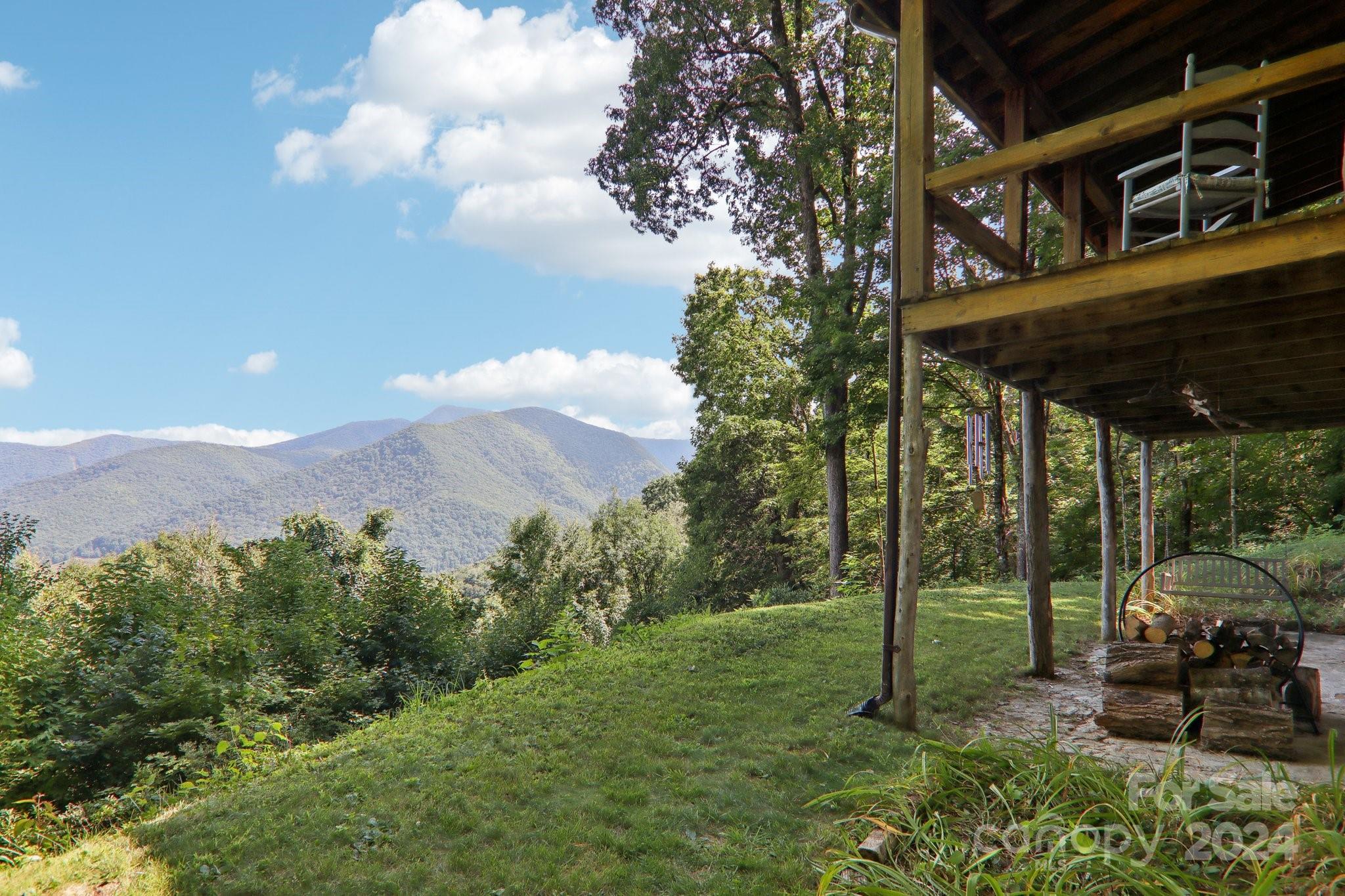 1685 Setzercove Road Maggie Valley, NC 28751 - Photo 31 of 42 a view of a porch with a yard
